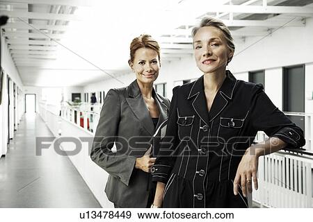 Business women smiling View Large Photo Image Stock Photo - Business women smiling. Fotosearch