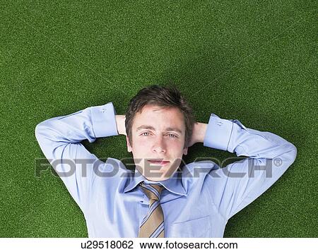 businessman lying on grass View Large Photo Image Stock Image - businessman lying on grass. Fotosearch