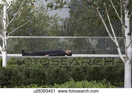 Stock Image - businessman using laptop outside. Fotosearch