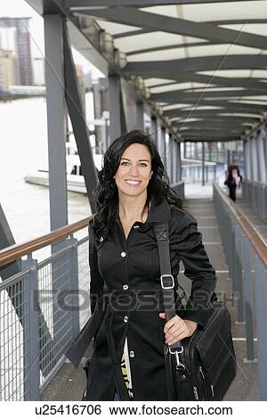 Stock Photograph - Businesswoman commuting. Fotosearch
