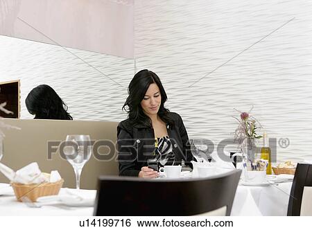 Businesswoman in restaurant View Large Photo Image Stock Photograph - Businesswoman in restaurant. Fotosearch