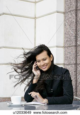 Stock Photo - Businesswoman on mobile. Fotosearch