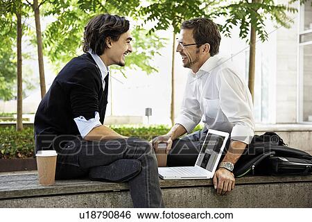 Colleagues having coffee View Large Photo Image Stock Photograph - Colleagues having coffee. Fotosearch