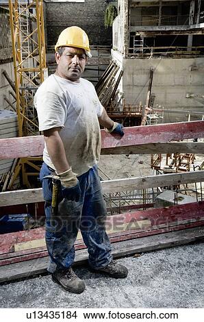 Picture - Construction worker at building site. Fotosearch