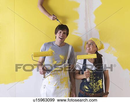 Stock Photo - Couple messing around with paint.. Fotosearch