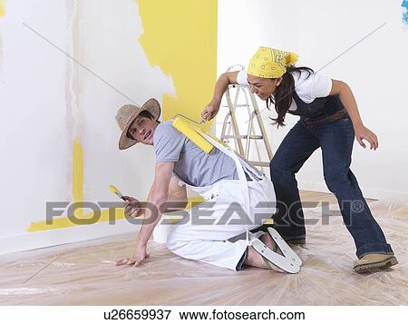 Stock Photo - Couple messing around with paint.. Fotosearch