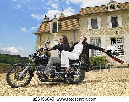 Couple on motorbike View Large Photo Image Stock Photo - Couple on motorbike. Fotosearch