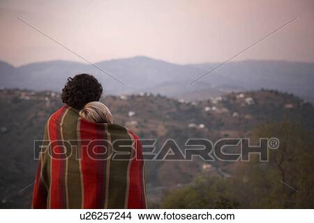 couple sharing a blanket View Large Photo Image Picture - couple sharing a blanket. Fotosearch