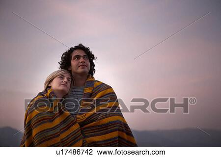 couple sharing a blanket View Large Photo Image Stock Image - couple sharing a blanket. Fotosearch