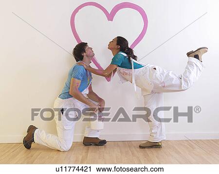 Couple with heart painting. View Large Photo Image Stock Image - Couple with heart painting.. Fotosearch