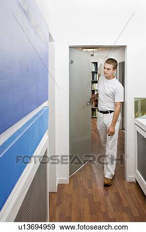Dental patient entering the exam room View Large Photo Image Stock Photo - Dental patient entering the exam room. Fotosearch