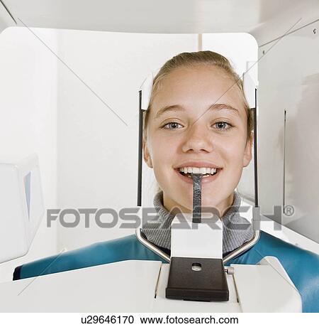 Stock Image - Dental patient getting an x-ray taken. Fotosearch
