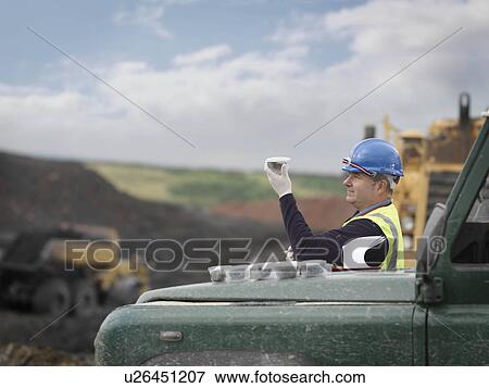 Stock Photo - Ecologist Inspecting Soil Samples. Fotosearch