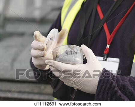 Stock Image - Ecologist With Soil Sample. Fotosearch