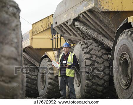 Stock Image - Ecologist With Truck. Fotosearch