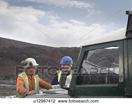 Stock Image - Ecologists Talking At Mine. Fotosearch