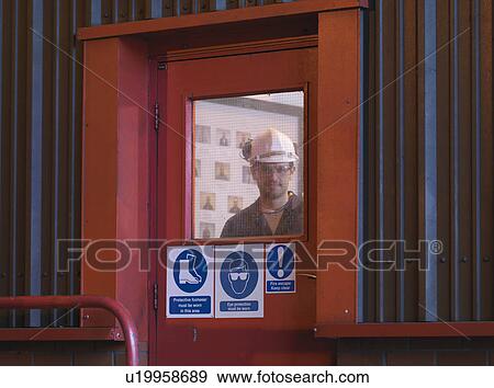 Stock Photo - Engineer In Doorway. Fotosearch