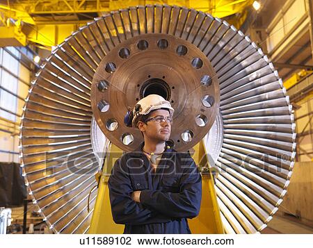 Engineer In Front Of Turbine View Large Photo Image Stock Image - Engineer In Front Of Turbine. Fotosearch