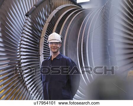 Engineer In Front Of Turbine View Large Photo Image Stock Image - Engineer In Front Of Turbine. Fotosearch