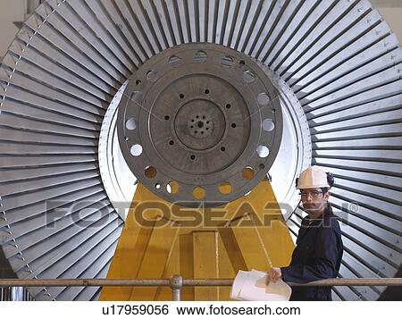 Engineer In Front Of Turbine View Large Photo Image Stock Photograph - Engineer In Front Of Turbine. Fotosearch