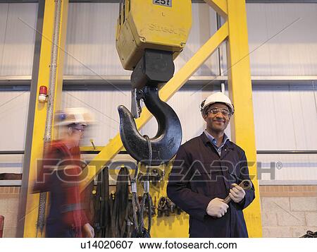 Stock Photo - Engineer With Crane. Fotosearch