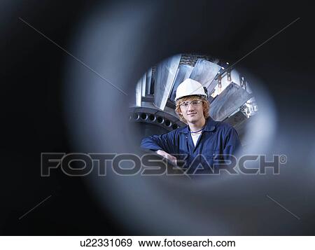 Stock Photo - Engineer With Turbine. Fotosearch
