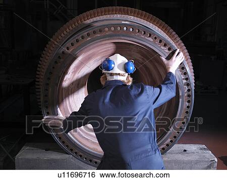 Stock Photograph - Engineer With Turbine. Fotosearch