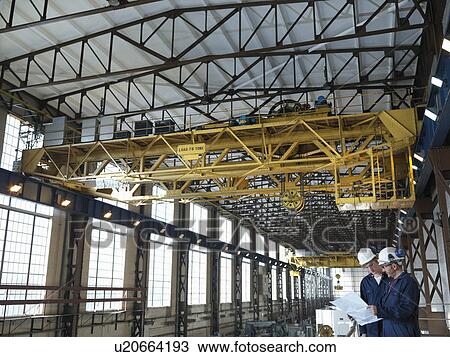 Stock Image - Engineers Above Turbine Hall. Fotosearch