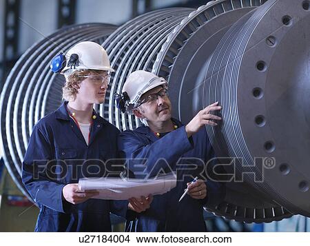 Picture - Engineers Inspecting Turbine. Fotosearch