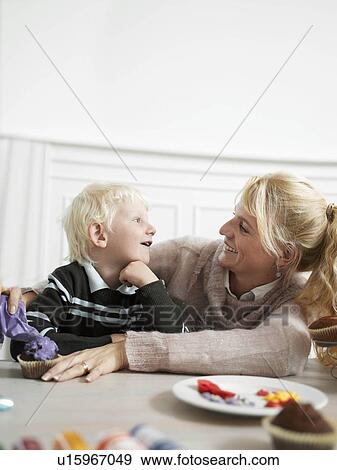 Stock Photo - Family making Cupcakes. Fotosearch