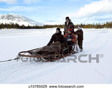 Family on sledge View Large Photo Image Stock Photo - Family on sledge. Fotosearch