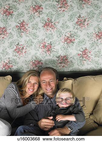 Family watching television View Large Photo Image Stock Photo - Family watching television. Fotosearch
