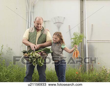 Farmer And Daughter With Vegetables View Large Photo Image Stock Image - Farmer And Daughter With Vegetables. Fotosearch
