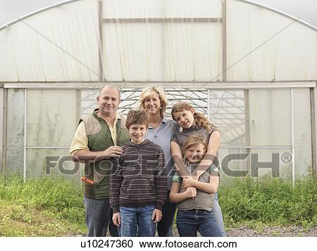 Farmer And Family Outside Polytunnel View Large Photo Image Stock Image - Farmer And Family Outside Polytunnel. Fotosearch