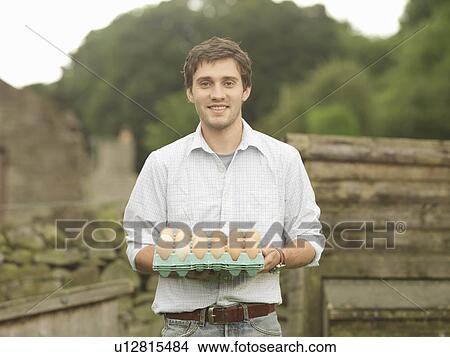 Farmer Holding A Tray Of Eggs View Large Photo Image Picture - Farmer Holding A Tray Of Eggs. Fotosearch