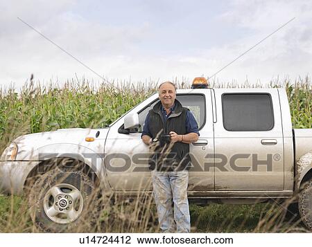 Farmer In Field With Car And Thermos View Large Photo Image Stock Image - Farmer In Field With Car And Thermos. Fotosearch