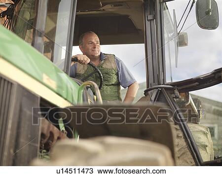 Farmer In Tractor View Large Photo Image Stock Image - Farmer In Tractor. Fotosearch