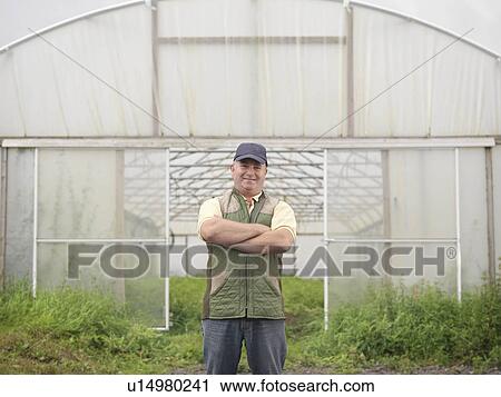 Farmer Standing Outside Polytunnel View Large Photo Image Stock Image - Farmer Standing Outside Polytunnel. Fotosearch