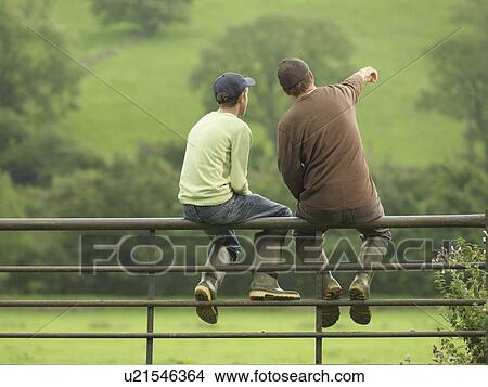 Farmer Talking To Son On Gate View Large Photo Image Picture - Farmer Talking To Son On Gate. Fotosearch