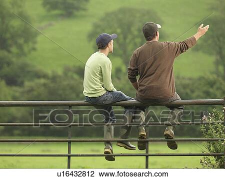 Farmer Talking To Son On Gate View Large Photo Image Stock Image - Farmer Talking To Son On Gate. Fotosearch