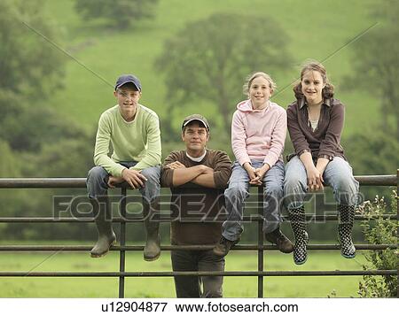 Farmer With Children On Gate View Large Photo Image Stock Photo - Farmer With Children On Gate. Fotosearch