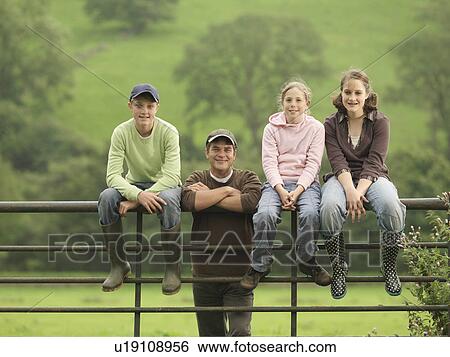 Farmer With Children On Gate View Large Photo Image Stock Photograph - Farmer With Children On Gate. Fotosearch