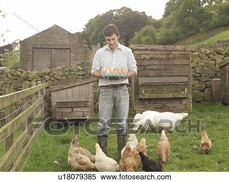 Stock Photography - Farmer With Eggs, Hens And Geese. Fotosearch