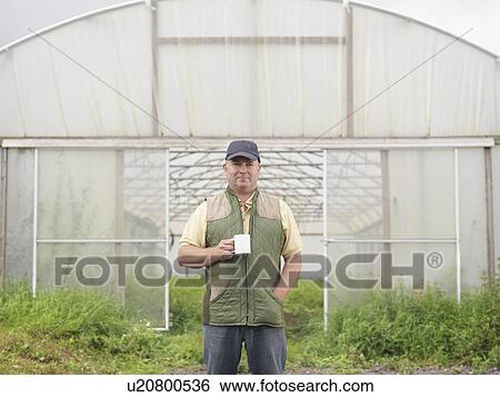 Farmer With Mug Outside Polytunnel View Large Photo Image Stock Photograph - Farmer With Mug Outside Polytunnel. Fotosearch