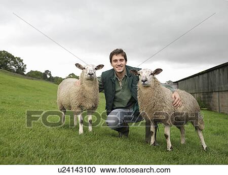 Stock Image - Farmer With Sheep. Fotosearch