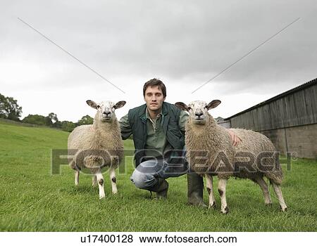 Stock Photo - Farmer With Sheep. Fotosearch