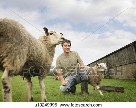 Stock Photography - Farmer With Sheep. Fotosearch