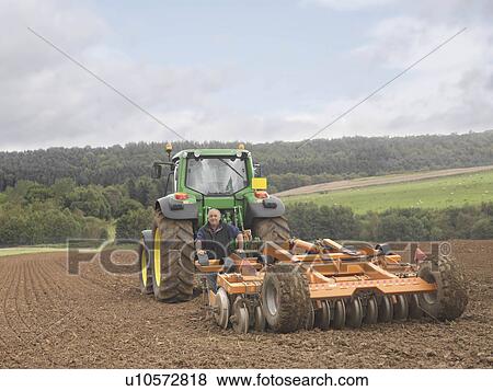 Farmer With Tractor In Field View Large Photo Image Stock Photo - Farmer With Tractor In Field. Fotosearch