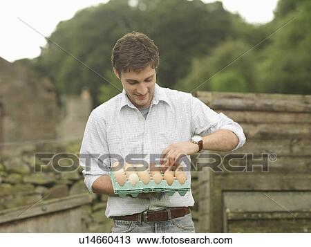 Farmer With Tray Of Eggs View Large Photo Image Stock Image - Farmer With Tray Of Eggs. Fotosearch