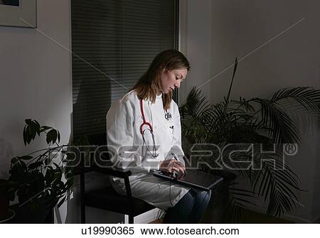 Female doctor using tablet pc View Large Photo Image Stock Photography - Female doctor using tablet pc. Fotosearch
